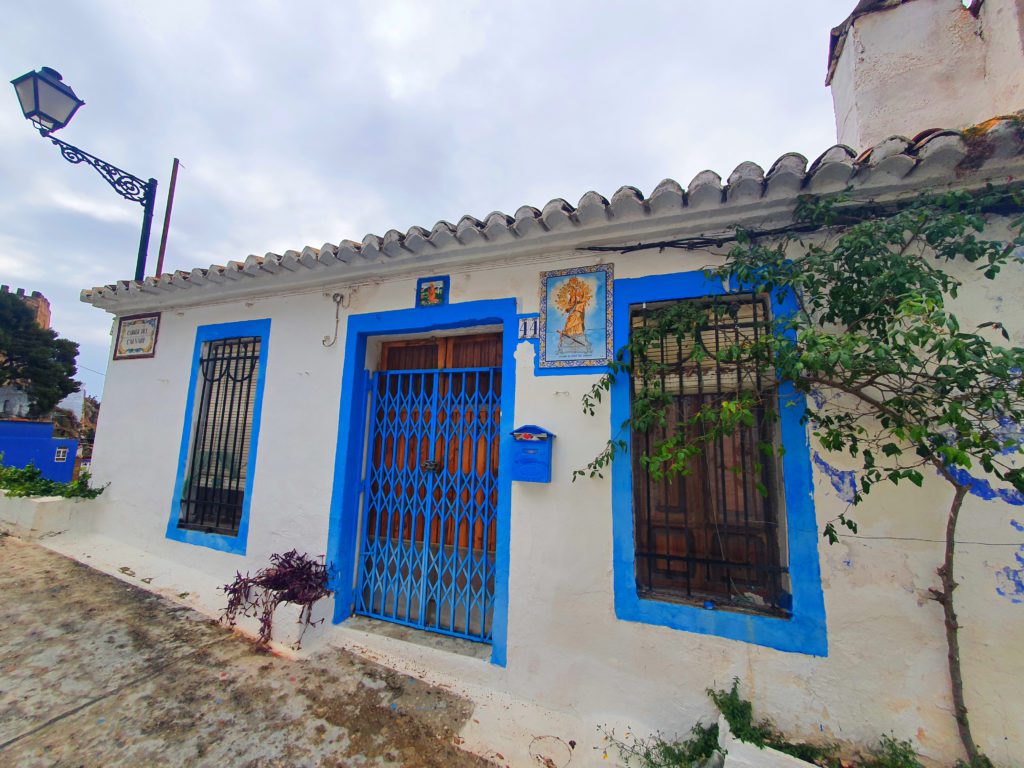 One of the many traditional cottages built into the rock on the climb to the castle